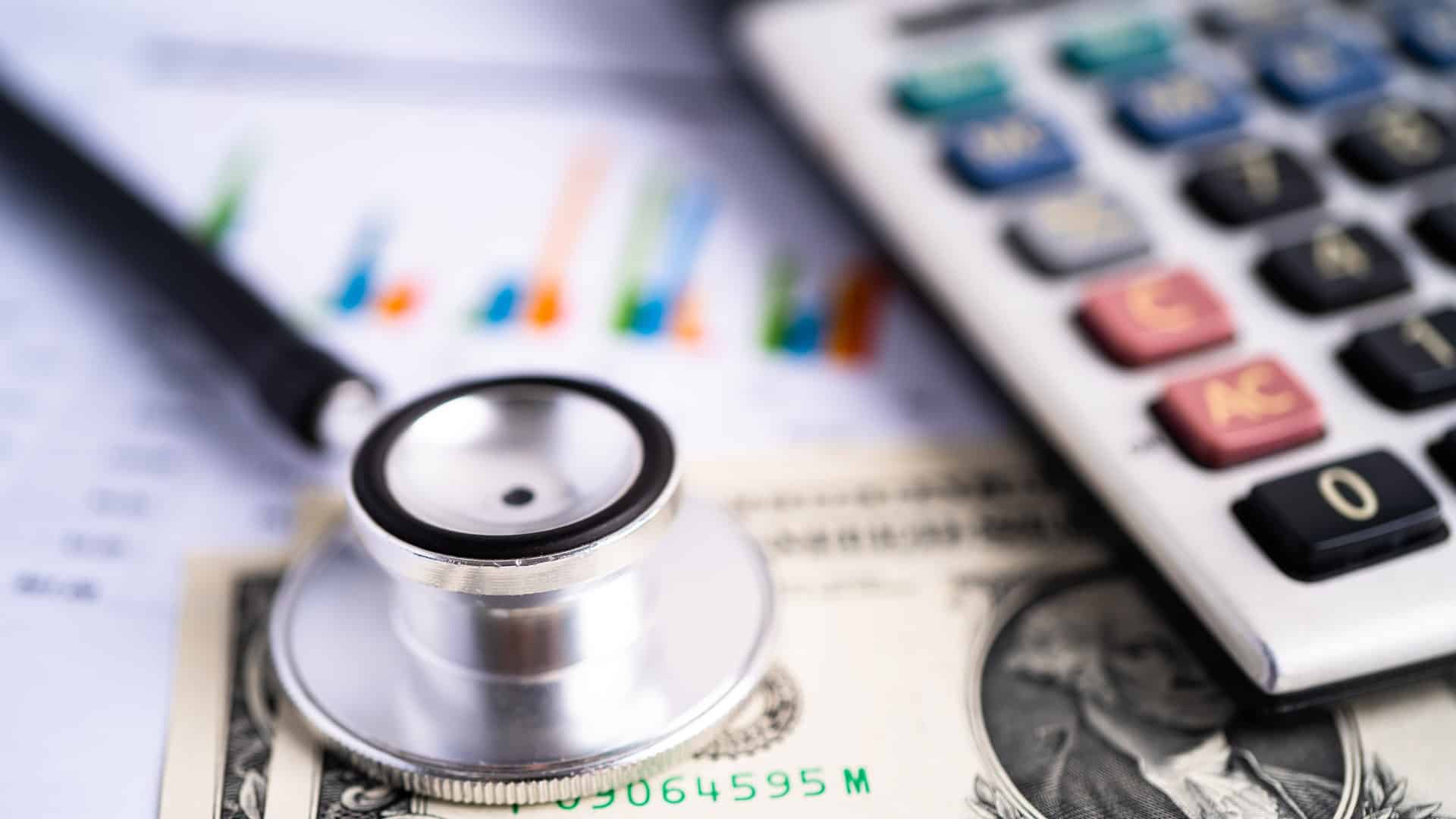medium-vecteezy_stethoscope-with-us-dollar-banknotes-on-chart-graph-paper_5471044_medium