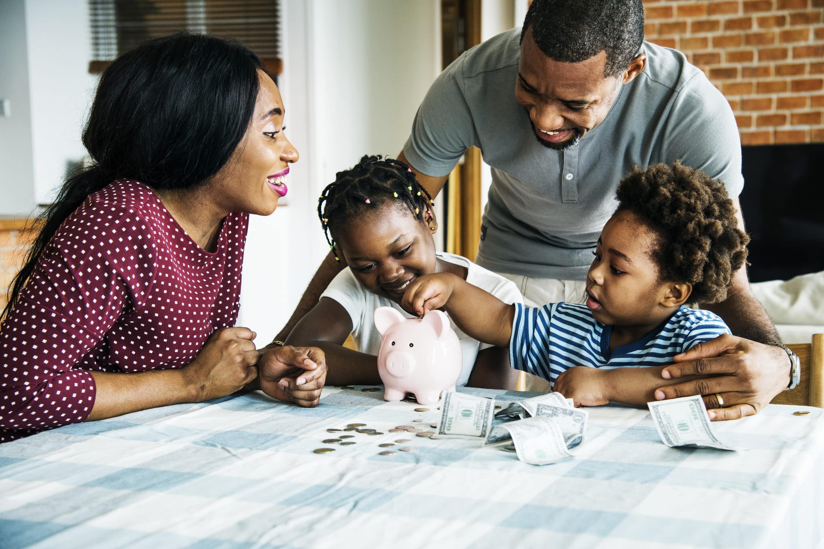 family-saving-money-in-piggy-bank-2026-01-07-23-36-18-utc